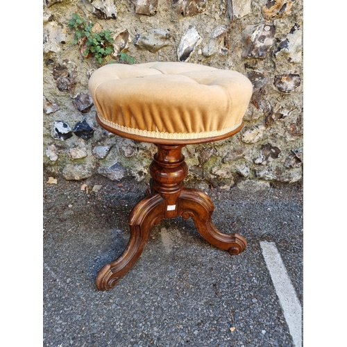 1065 - An Edwardian Sutherland table; together with a walnut piano stool. 