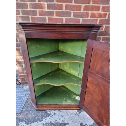 1067 - An antique mahogany corner cupboard, 89cm wide x 112cm high.