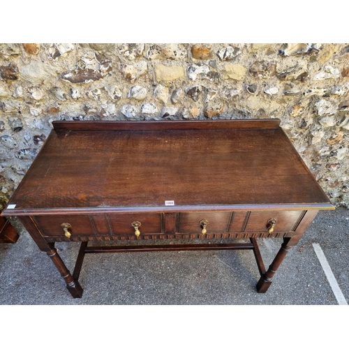 1069 - A Waring & Gillow two drawer side table, 114cm wide x 82cm high x 52cm deep.