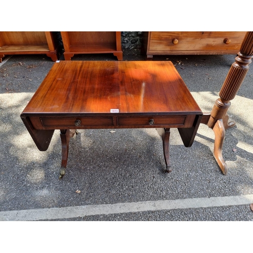 1073 - A small reproduction coffee table; together with a mahogany torchere, (a.f.).