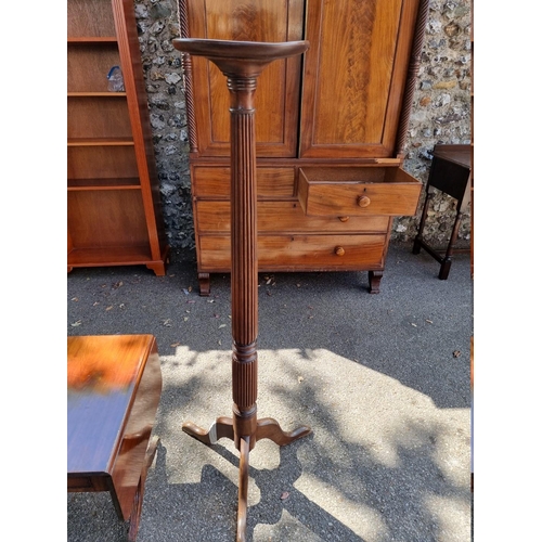 1073 - A small reproduction coffee table; together with a mahogany torchere, (a.f.).