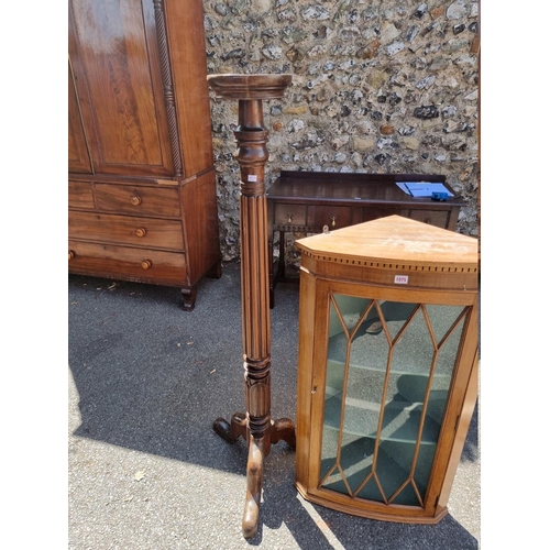 1075 - An antique hanging corner cupboard; together with a mahogany torchere.