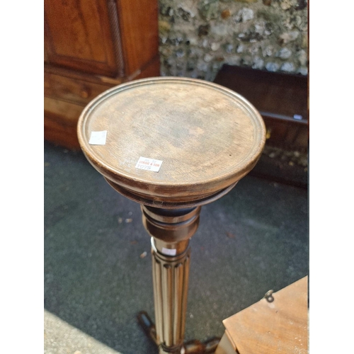 1075 - An antique hanging corner cupboard; together with a mahogany torchere.