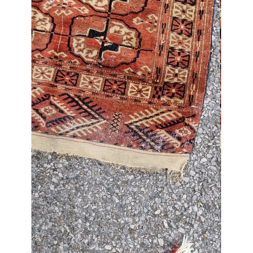 1088 - A small Bokhara runner, having repeated central field, 200cm x 82cm; together with a small floral ru... 