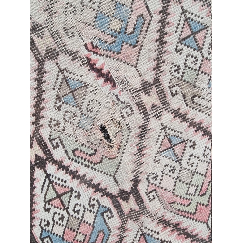 1089 - A North West Persian rug, having repeated central field, with geometric borders, 188cm x 113cm.... 