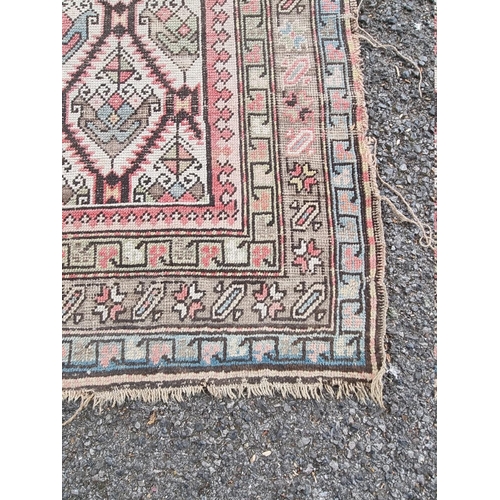 1089 - A North West Persian rug, having repeated central field, with geometric borders, 188cm x 113cm.... 