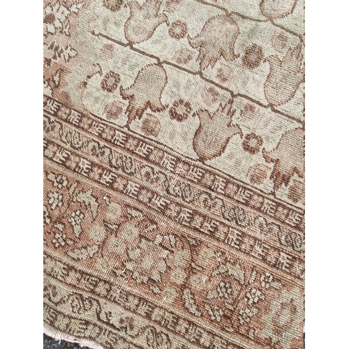 1091 - A pair of Persian rugs, having central floral medallions, with floral cartouches to each corner... 