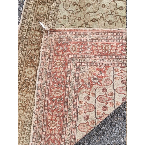 1091 - A pair of Persian rugs, having central floral medallions, with floral cartouches to each corner... 