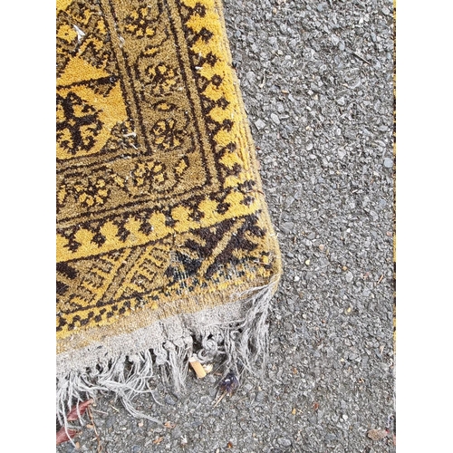 1098 - An Afghan rug, on yellow ground, 215cm x 150cm; together with another smaller Afghan rug, 188cm... 