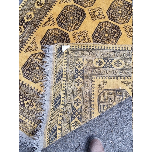 1098 - An Afghan rug, on yellow ground, 215cm x 150cm; together with another smaller Afghan rug, 188cm... 