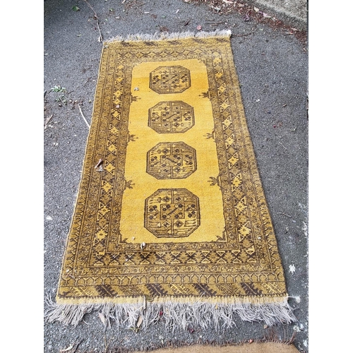 1098 - An Afghan rug, on yellow ground, 215cm x 150cm; together with another smaller Afghan rug, 188cm... 