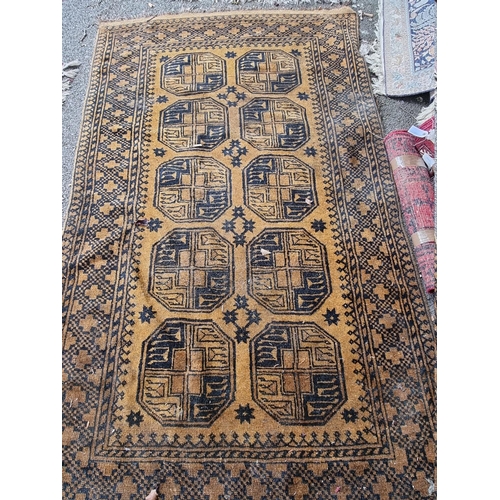 1099 - An Afghan rug, on yellow ground, 235cm x 135cm.