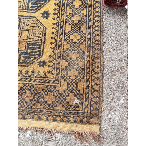 1099 - An Afghan rug, on yellow ground, 235cm x 135cm.