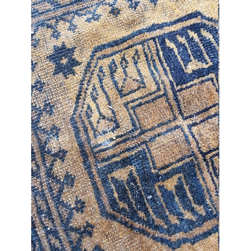 1099 - An Afghan rug, on yellow ground, 235cm x 135cm.