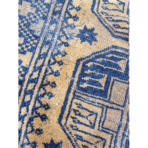 1099 - An Afghan rug, on yellow ground, 235cm x 135cm.