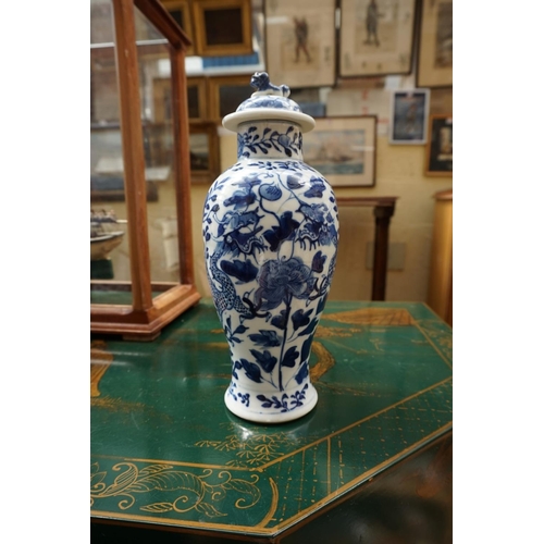 1132 - A Chinese blue and white vase and cover, 21.5cm high; another smaller vase, 13.5cm high, (hairline c... 