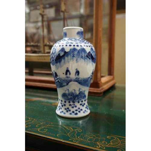 1132 - A Chinese blue and white vase and cover, 21.5cm high; another smaller vase, 13.5cm high, (hairline c... 