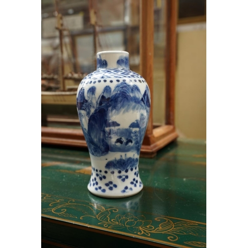 1132 - A Chinese blue and white vase and cover, 21.5cm high; another smaller vase, 13.5cm high, (hairline c... 