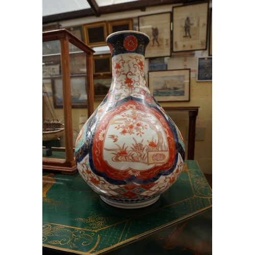 1134 - A Japanese Imari baluster vase, 29cm high; and other Oriental ceramics. (11)