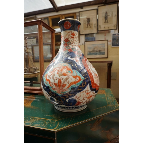 1134 - A Japanese Imari baluster vase, 29cm high; and other Oriental ceramics. (11)