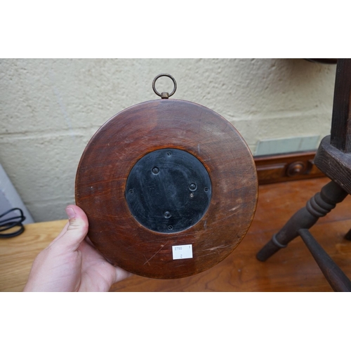 1159 - A circa 1900 carved walnut aneroid barometer, 21.5cm diameter.