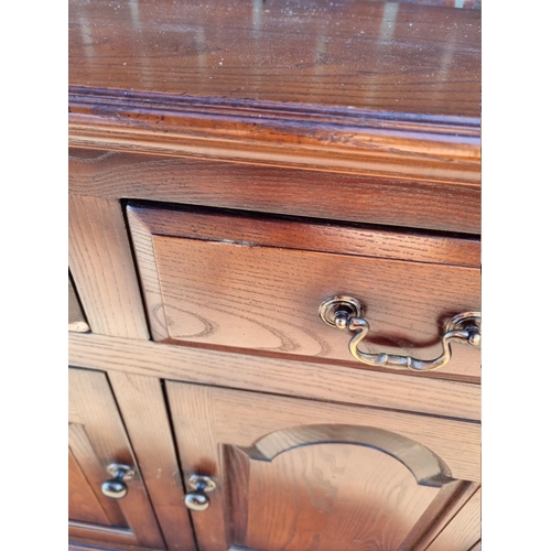 1163 - A reproduction oak dresser base, 137cm wide. En suite with the previous lot. ... 