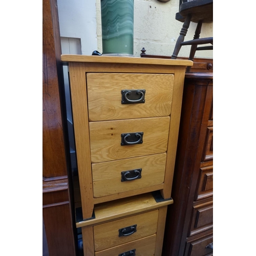 1168 - A pair of contemporary pale oak bedside chests, 66cm high x 48cm wide. 