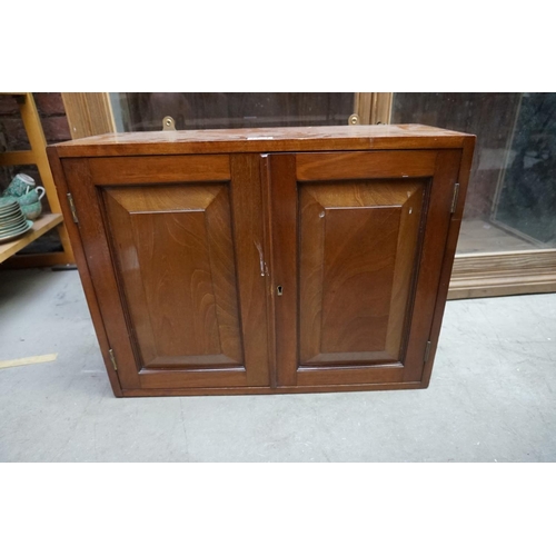 1171 - An Edwardian mahogany hanging cupboard, with a pair of fielded panel doors, 41.5cm high x 53.5cm wid... 