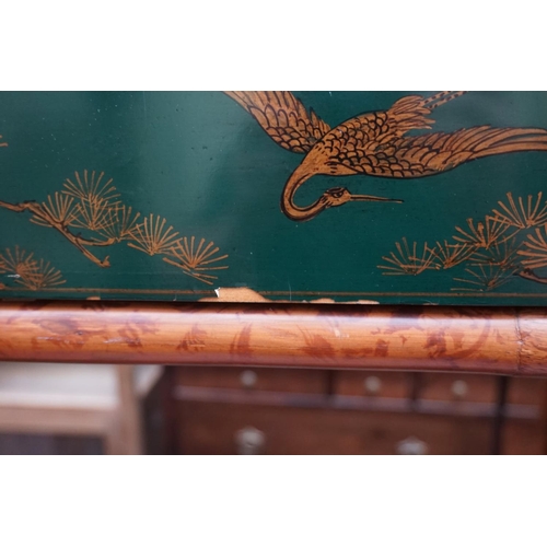 1176 - A bamboo and green lacquered two tier occasional table, labelled 'Maitland-Smith', with chinoiserie ... 