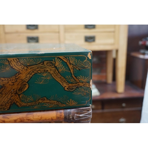 1176 - A bamboo and green lacquered two tier occasional table, labelled 'Maitland-Smith', with chinoiserie ... 