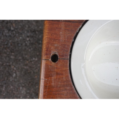 1178 - An old walnut and cane commode stool, 58.5cm wide.