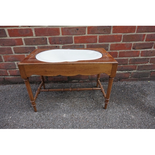 1178 - An old walnut and cane commode stool, 58.5cm wide.