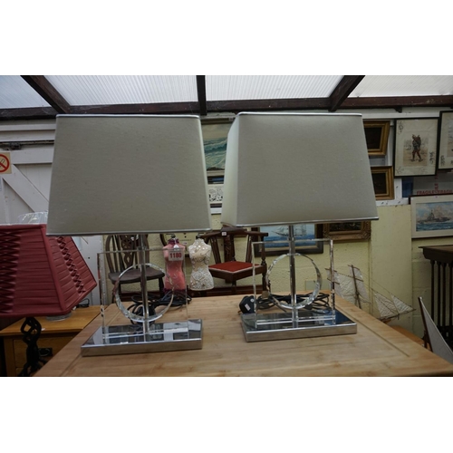 1180 - A pair of contemporary glass and chrome table lamps, height including shades, 36cm. ... 