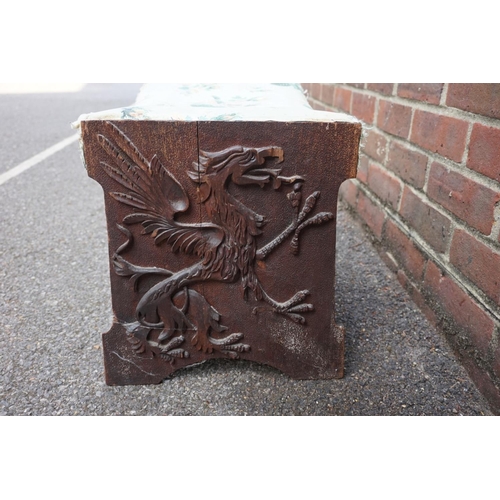 1187 - An old carved walnut and upholstered stool, relief decorated with a griffin and a winged unicorn to ... 