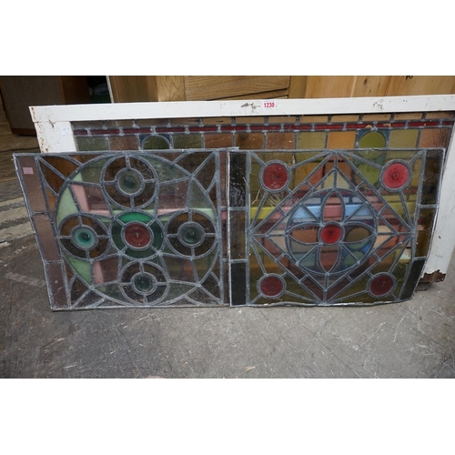 1230 - Three leaded and stained glass panels, largest 93.5cm wide, (a.f).