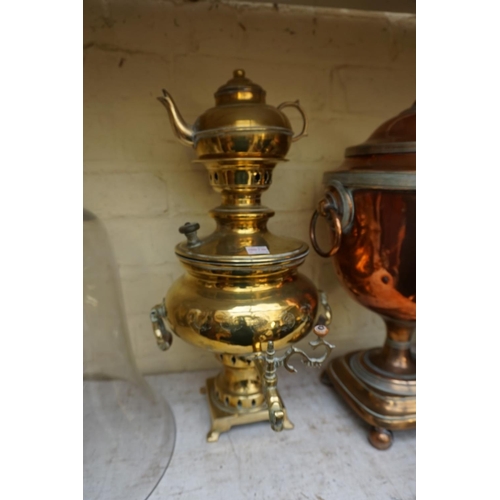 1238 - A 19th century copper and brass samovar, 44cm high; together with another brass tea urn.... 