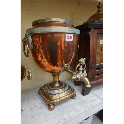 1238 - A 19th century copper and brass samovar, 44cm high; together with another brass tea urn.... 