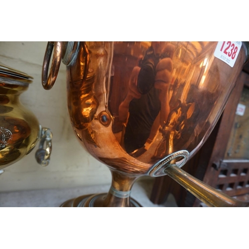 1238 - A 19th century copper and brass samovar, 44cm high; together with another brass tea urn.... 