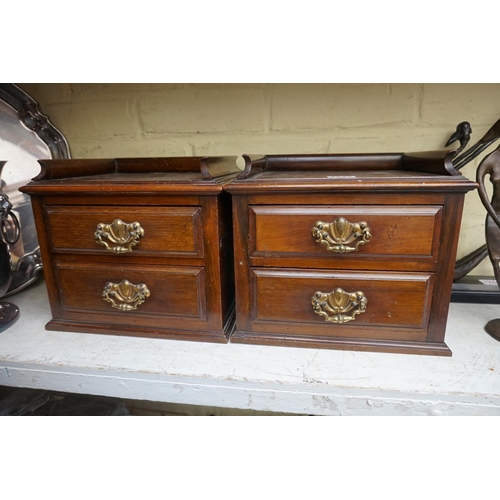 1243 - A small pair of late Victorian two drawer chests, 27cm wide, (formally part of a larger item).... 