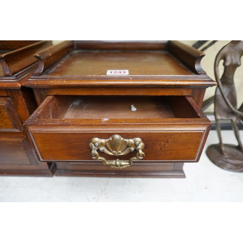 1243 - A small pair of late Victorian two drawer chests, 27cm wide, (formally part of a larger item).... 