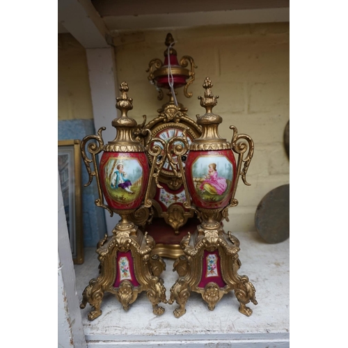 1247 - A gilt spelter and porcelain mounted clock garniture, the clock 37cm high, with pendulum. ... 