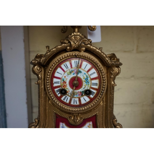 1247 - A gilt spelter and porcelain mounted clock garniture, the clock 37cm high, with pendulum. ... 