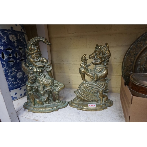 1257 - A pair of antique cast brass Punch and Judy doorstops, 28.5cm high. 