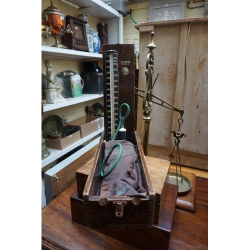 1265 - A vintage doctors' blood pressure gauge, boxed; together with a mahogany writing box, 35cm wide; and... 