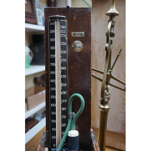 1265 - A vintage doctors' blood pressure gauge, boxed; together with a mahogany writing box, 35cm wide; and... 