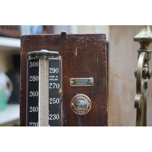 1265 - A vintage doctors' blood pressure gauge, boxed; together with a mahogany writing box, 35cm wide; and... 