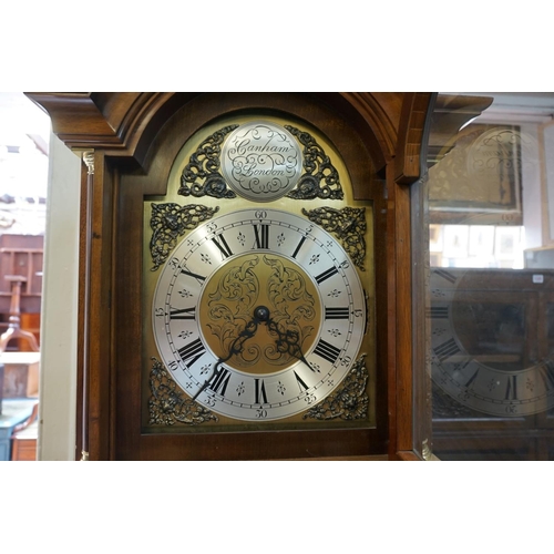 1334 - A good reproduction walnut longcase clock, the 10in arched dial inscribed 'Canham, London', 198cm hi... 