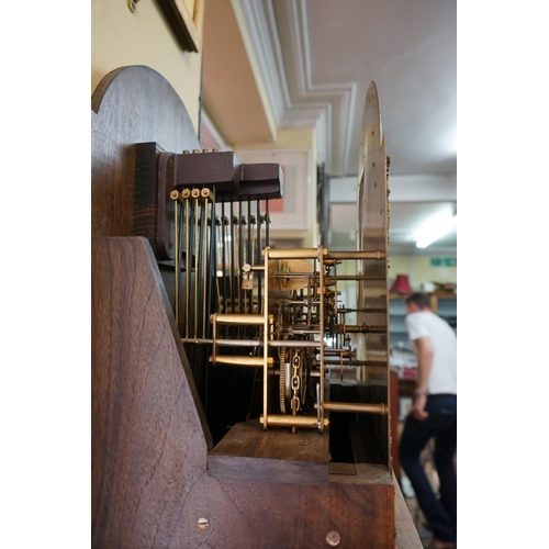 1334 - A good reproduction walnut longcase clock, the 10in arched dial inscribed 'Canham, London', 198cm hi... 