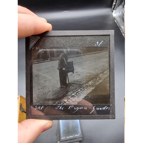 152 - MAGIC LANTERN SLIDES: LONDON STREET CHARACTERS: an unusual group of 50 uncoloured photographic lante... 