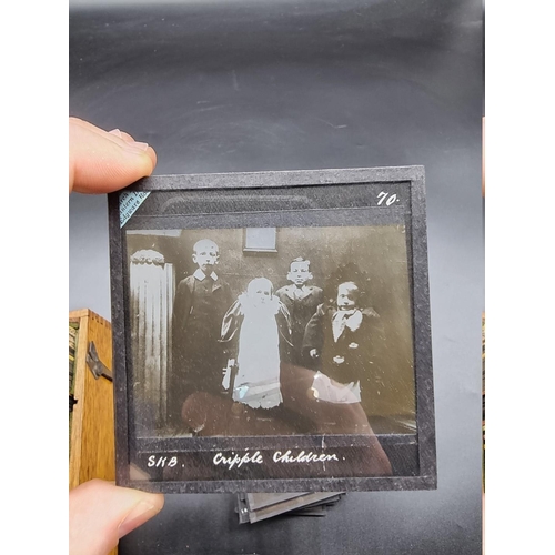 152 - MAGIC LANTERN SLIDES: LONDON STREET CHARACTERS: an unusual group of 50 uncoloured photographic lante... 